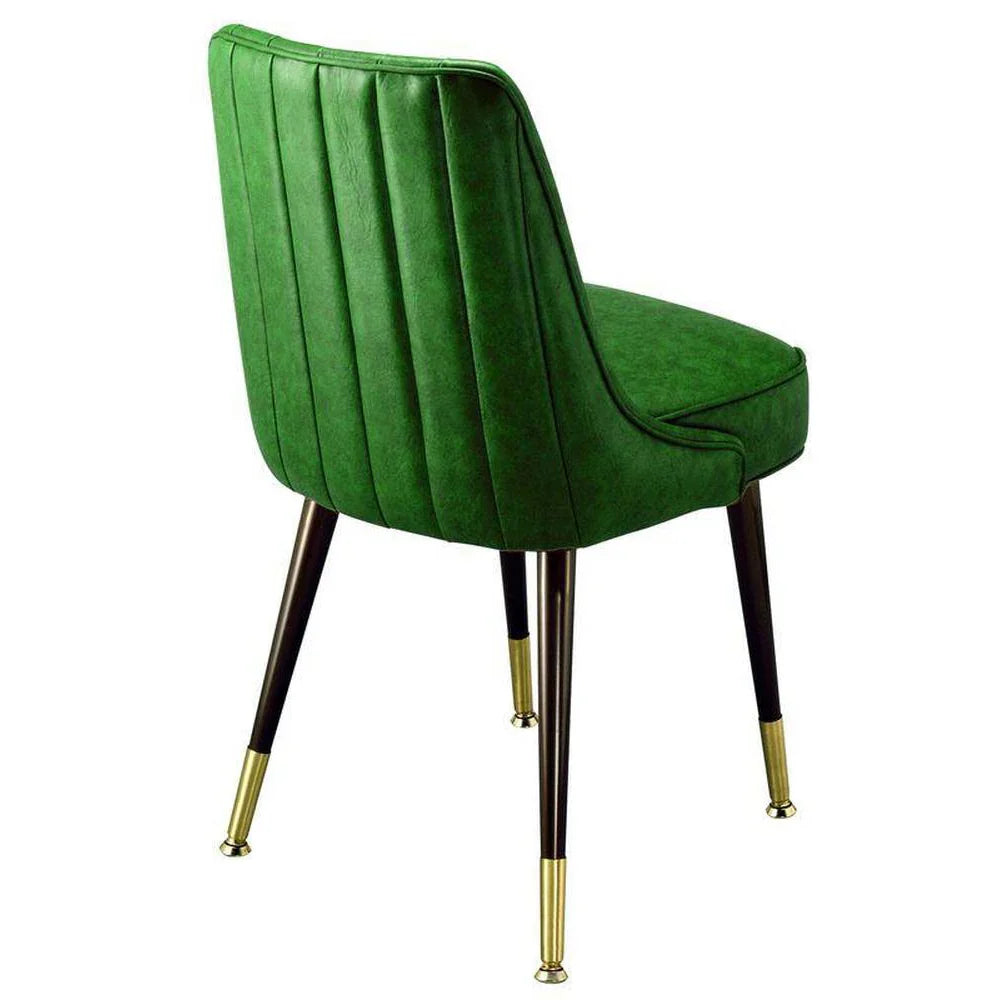 club chair with black industrial-gauge steel frame and brass ferrule base, featuring a retro vertical channel back and deeply padded waterfall seat. Custom vinyl upholstery available in hundreds of styles. Made in the USA for restaurants and hospitality interiors.