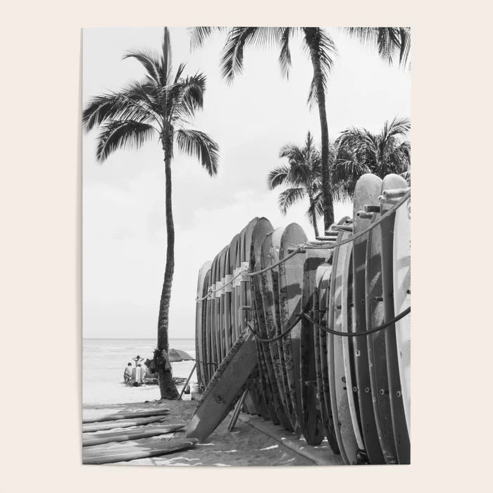 Black and white Hawaiian surfboards photography poster displayed in café interior
