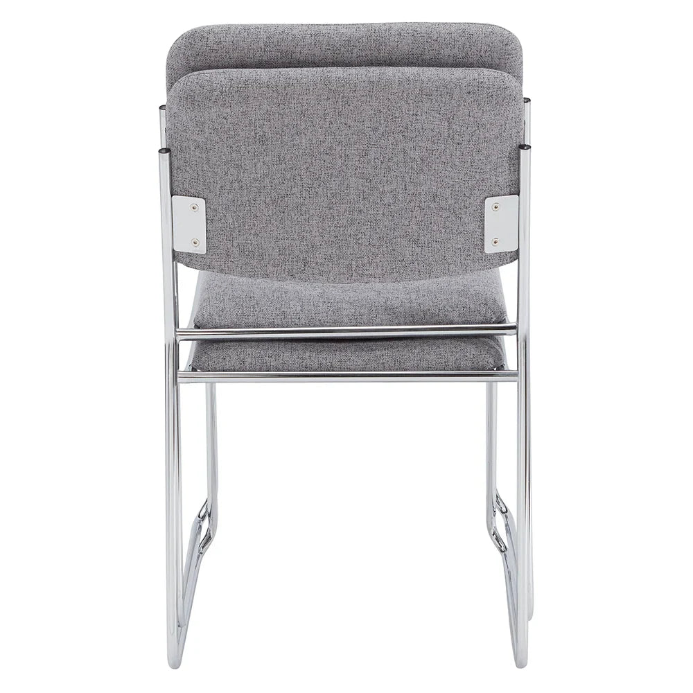 Stack of gray fabric side chairs with silver steel frames, lightweight and space-saving design for conference rooms and event seating.