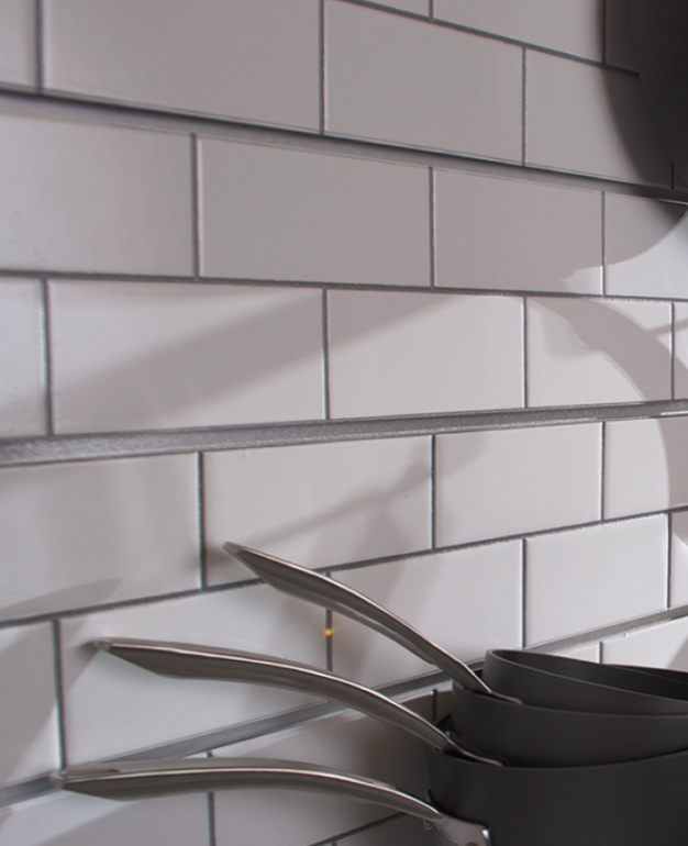 Faux subway tile wall panels installed in a commercial interior, creating a clean modern surface for restaurants, bars, or cafés.