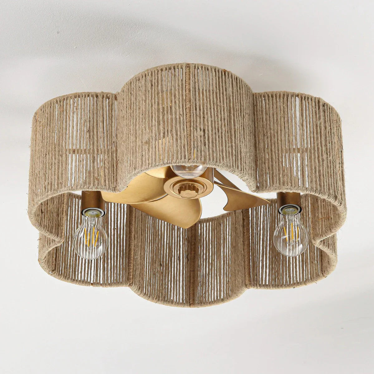 Flush-mount rattan ceiling fan with antique gold finish and LED light for cafés and bedrooms