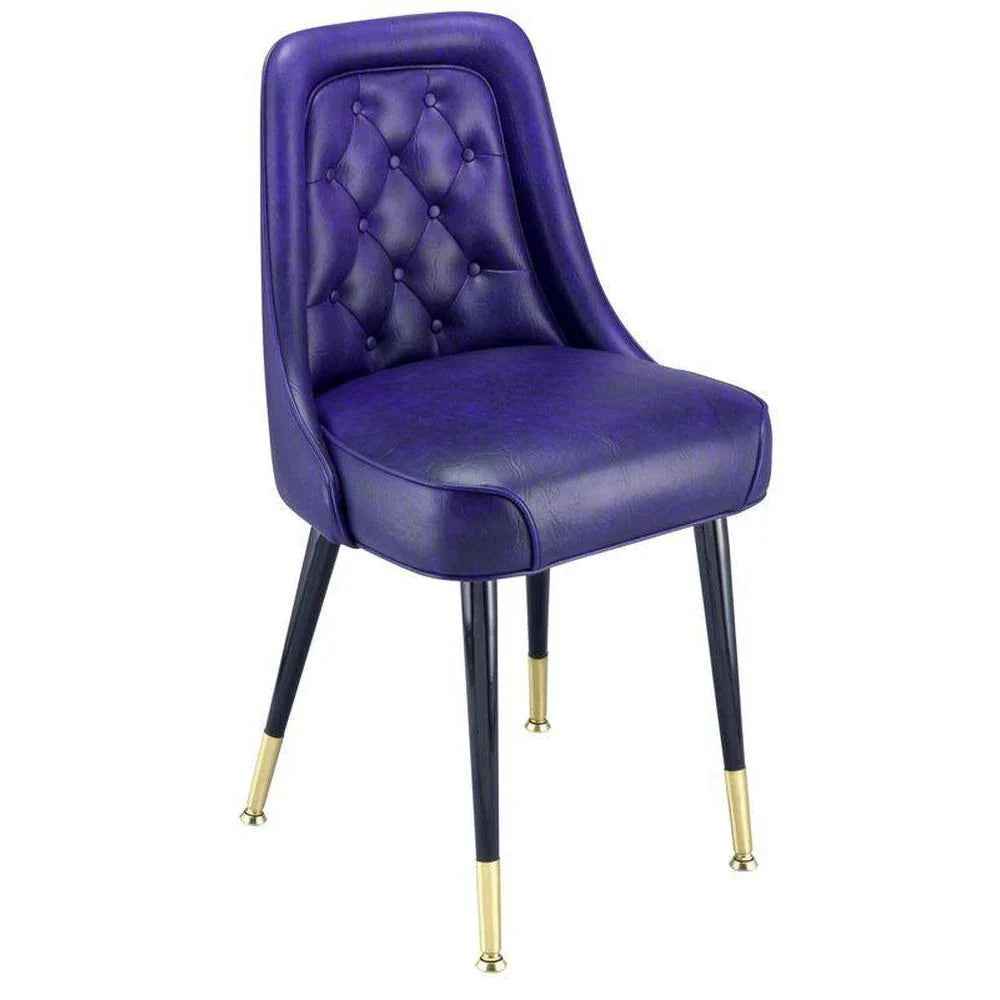 Dining chair with diamond tufted back, padded waterfall seat, and steel frame with brass ferrules.