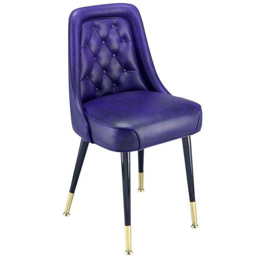 Dining chair with diamond tufted back, padded waterfall seat, and steel frame with brass ferrules.