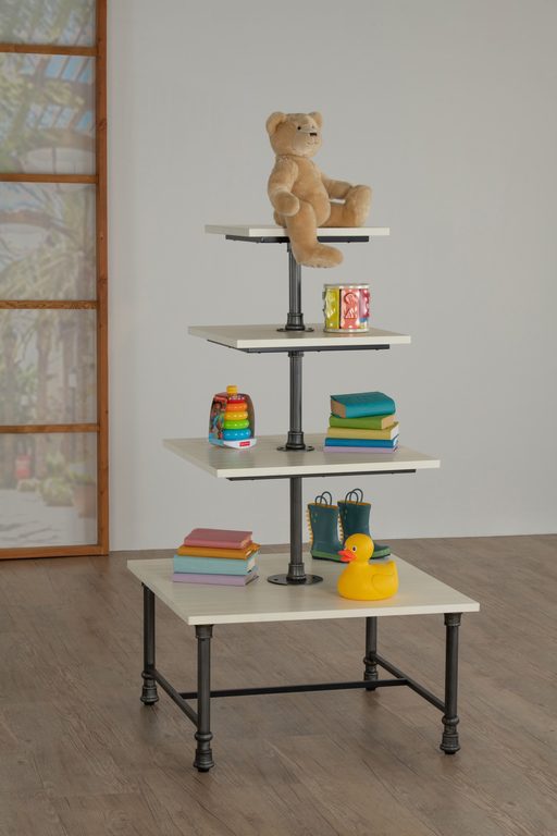 Front view of a 4-tier square display white table shown with a sturdy metal base and wood tiers, designed for multi-level merchandising in retail and hospitality environments.
