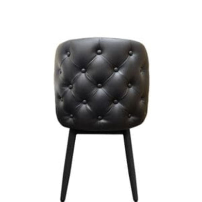 Amata chair with tufted bucket seat in black vinyl and faux black woodgrain metal frame.