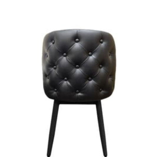 Amata chair with tufted bucket seat in black vinyl and faux black woodgrain metal frame.