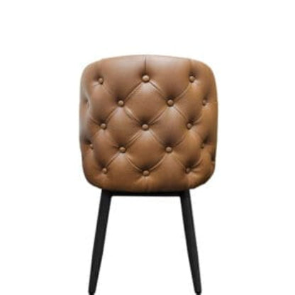 Back view Amata chair with tufted buckskin vinyl bucket seat and faux black woodgrain metal frame.