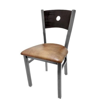 Dining chair with black wood back and buckskin vinyl seat.