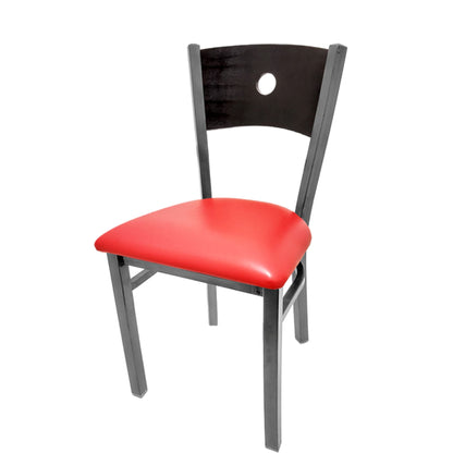Dining chair with black wood back and red vinyl seat.
