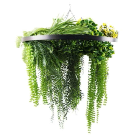 black hanging disc with draping ferns and greenery
