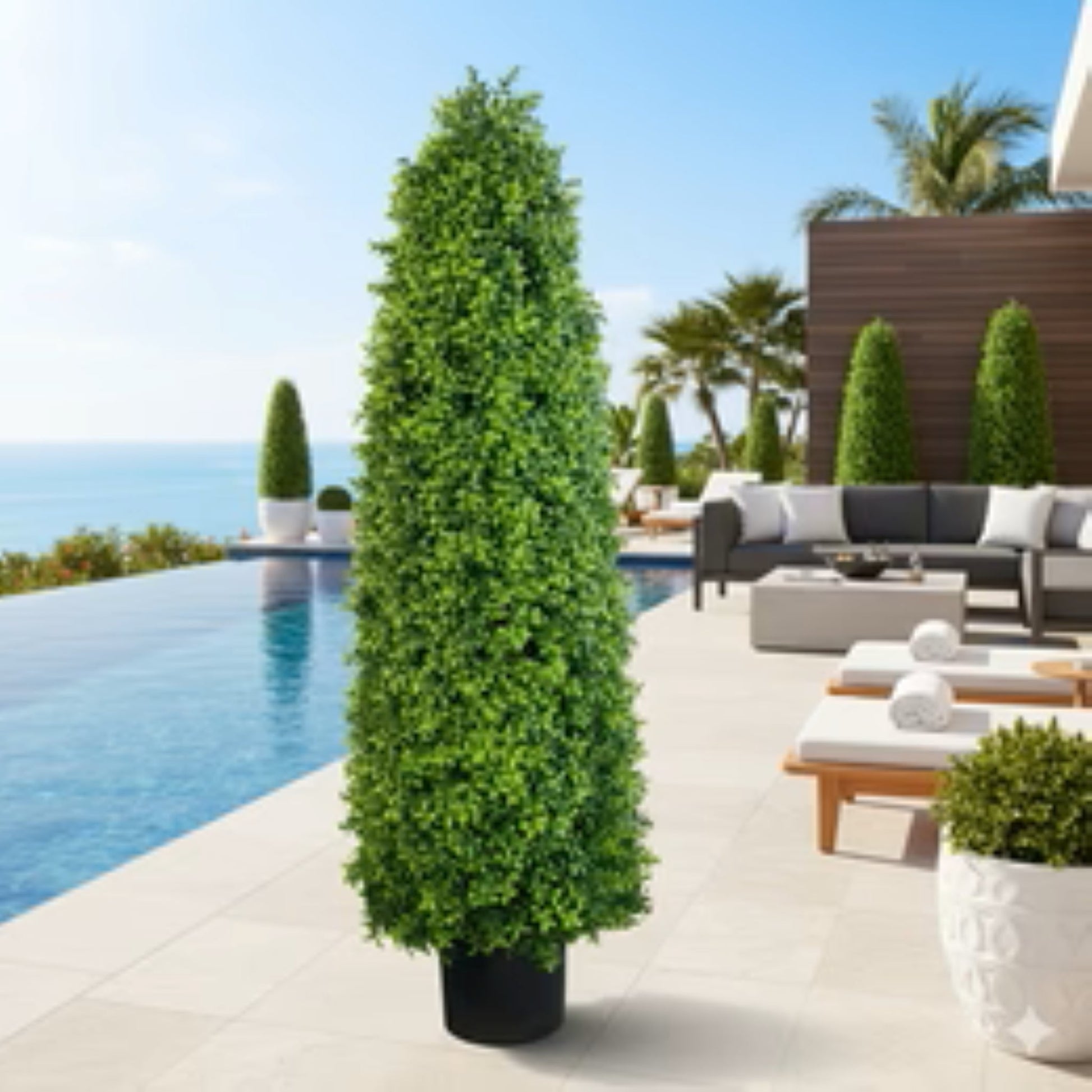 bright green artificial buxus in black pot