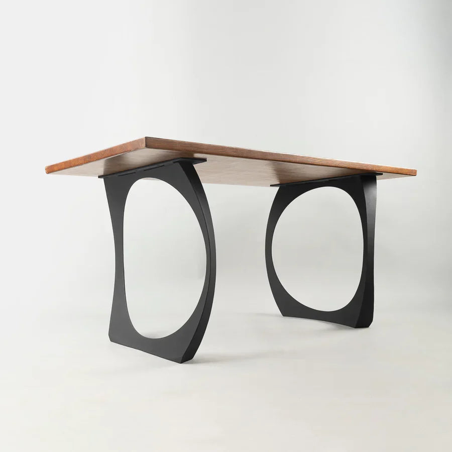 Front view of Cleo metal table legs in matte black steel, showing tall portal-style rectangular frame with clean lines and handcrafted construction, designed for restaurant and bar tables