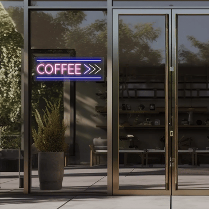 Neon coffee sign outside a building with glass doors.
