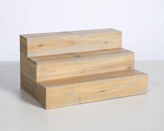 Three-step distressed pine back bar bottle riser with compact wooden frame and rear storage compartment.