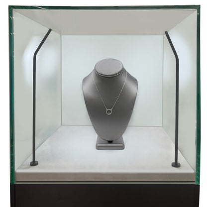 Close-up zoom of the black pedestal display case showing the 3/8-inch thick locking glass showcase and smooth melamine pedestal surface.