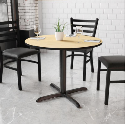 Oak finish dining table with sturdy black metal base shown with three matching restaurant dining chairs