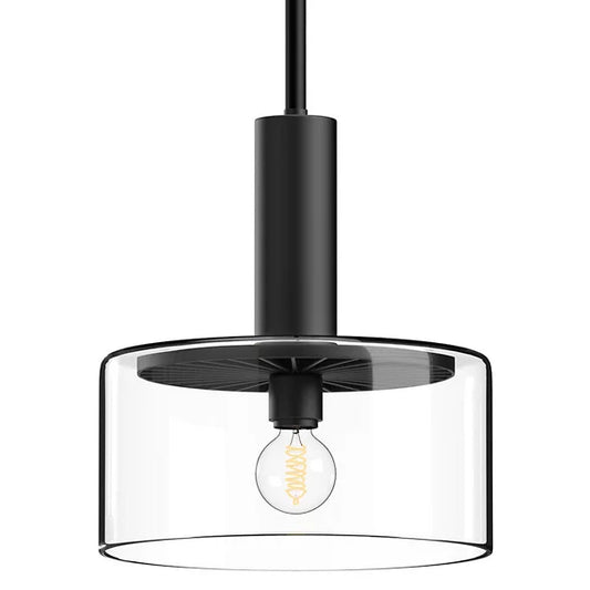 Royale pendant light in a black finish with a cylindrical metal body and clear glass drum shade, designed for modern bar and restaurant lighting.