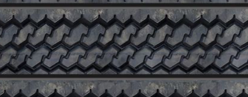 Close-up view of textured tire tread wall panel showing detailed repeating tread design.