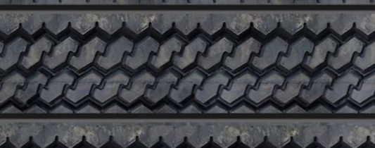 Close-up view of textured tire tread wall panel showing detailed repeating tread design.