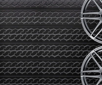 interior installation featuring a 24 by 96 inch tire tread wall panel used for automotive-themed décor.