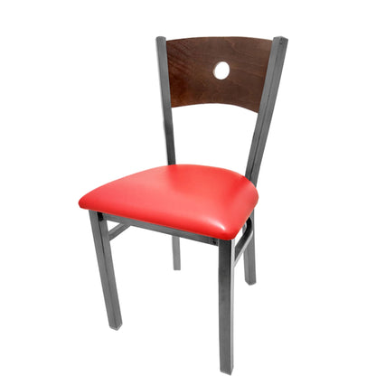 Dining chair with walnut wood back and red vinyl seat.
