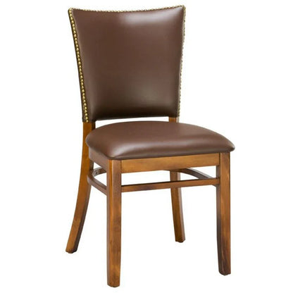 Beech wood dining chair in walnut finish with upholstered seat and brass nail trim along the backrest. Solid beech construction, custom upholstery, and stain options available. Made in the USA and ships fully assembled.