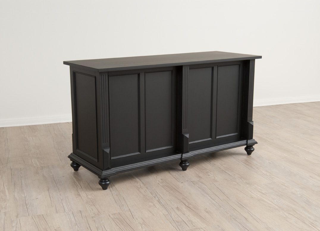 Front view of the Vintage Flat Top Retail Counter in a black painted finish, showing the clean flat surface, storage drawers, and lower shelving used for organized checkout operations.