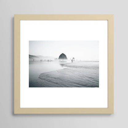 Cannon Beach Art Print framed in maple wood with warm tones, bringing natural coastal charm to hospitality interiors such as restaurants, resort lobbies, and beach cafés.