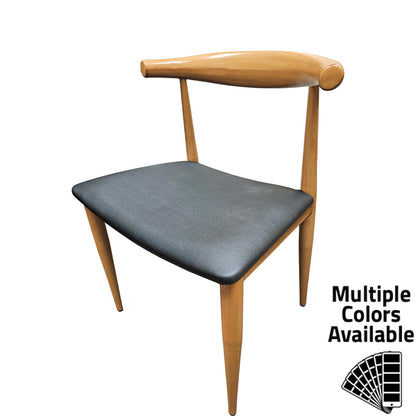 Elbow Chair with metal frame in natural clear coat faux wood finish and black vinyl seat. Durable indoor dining chair with non-marring glides and modern curved back design.
