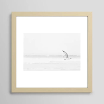Minimalist seagull beach print framed in light maple wood – black and white ocean photography wall decor