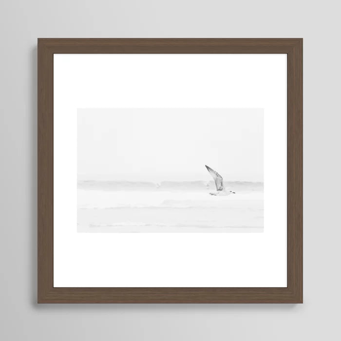 Black and white seagull ocean photography framed in walnut wood – fine art coastal wall print