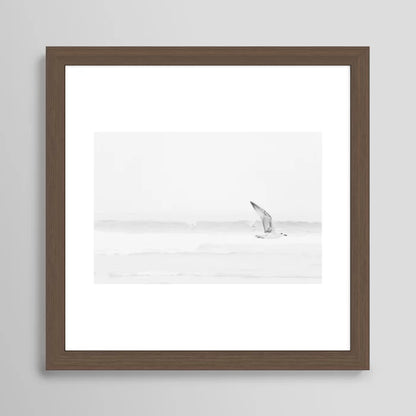 Black and white seagull ocean photography framed in walnut wood – fine art coastal wall print