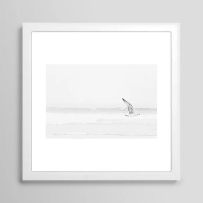Elegant minimalist seagull beach print in white wood frame – black and white coastal photography wall art
