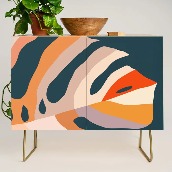 Alt Text:
Monstera Condiment Bar by Annick with gold steel legs – mid-century modern botanical design on birch, ideal for restaurants, boutique hotels, and contemporary cafés