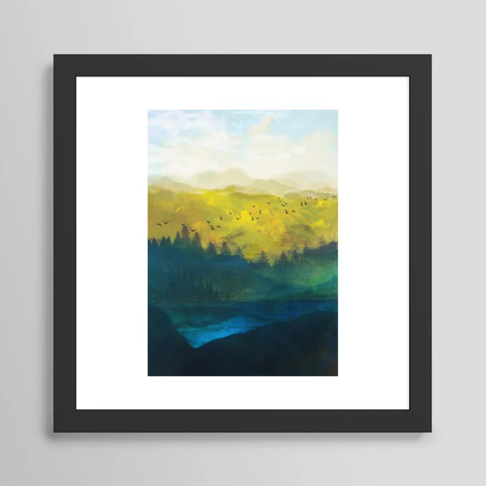 Mountain Lake Art Print by Nadja in black frame, serene mountain landscape wall art ideal for boutique hotels, restaurant dining rooms, and coffee house interiors.