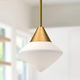 Gold metal Nora collection pendant light with a star-shaped opal glass shade, offering a modern schoolhouse look for contemporary interiors.
