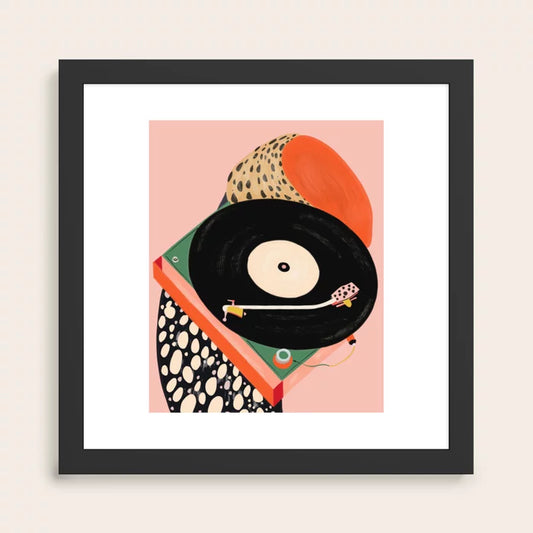 Nostalgic Grooves Art Print by Artsy Sesta in a black hardwood frame, featuring retro-inspired wall art perfect for cafés, hotel lounges, and restaurant interiors.