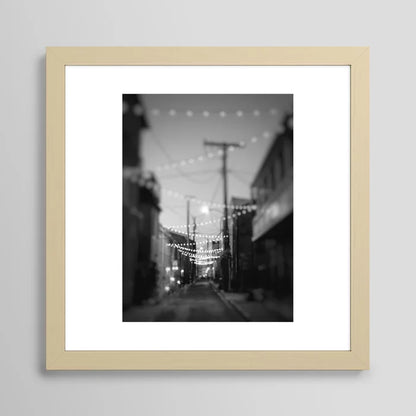 Party Lights in the City Baltimore Maryland Art Print in maple frame – warm natural wood tone adds inviting charm to bar walls, dining rooms, and hotel lobbies