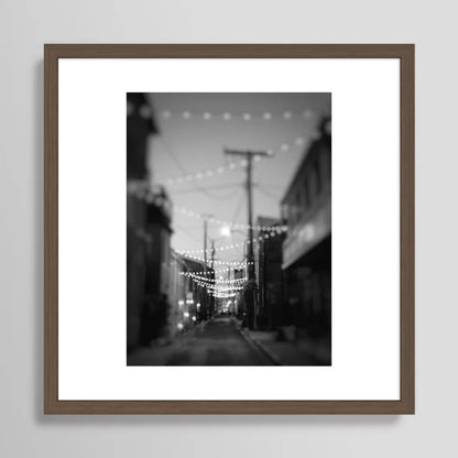 Alt Text:
Party Lights in the City Baltimore Maryland Art Print in walnut frame – rich dark wood frame enhances restaurant and hotel décor with a sophisticated city-night aesthetic