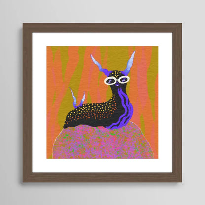 Sea Slug art print by Blindthesun in rich walnut frame adding warmth and contrast to vibrant marine artwork