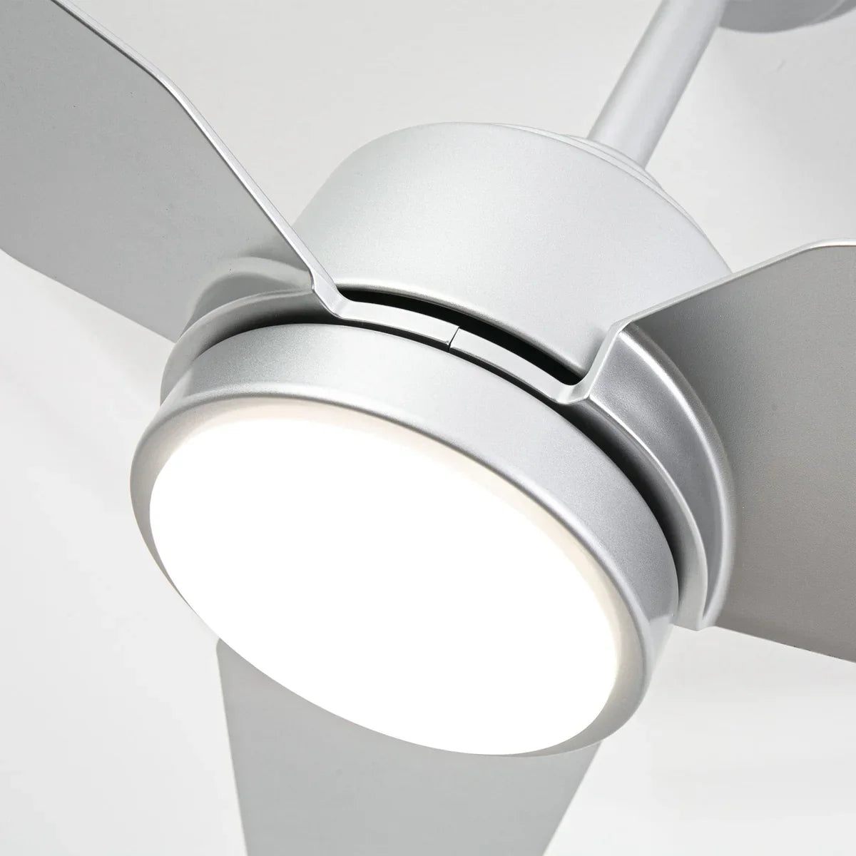 Close-up of a ceiling fan with light fixture on a white background