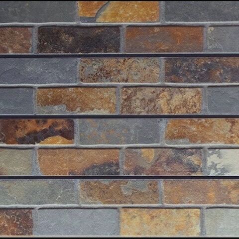 Faux brick wall panel in slate finish featuring dark gray bricks with textured surface and subtle variation for modern industrial interiors.