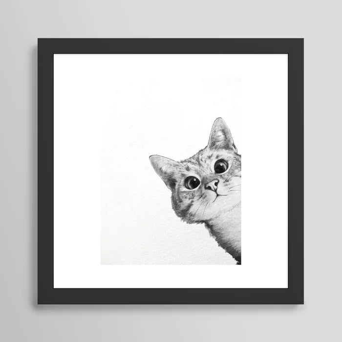 Sneaky cat framed art print in black frame, playful wall décor for cafés, restaurants, and boutique hotels