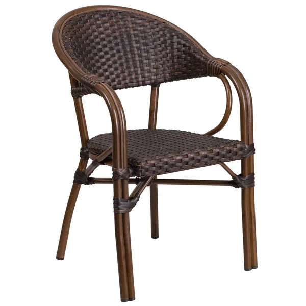 Dark brown bamboo-style aluminum café chair with arms and woven rattan seat, indoor and outdoor dining chair for restaurants and patios.