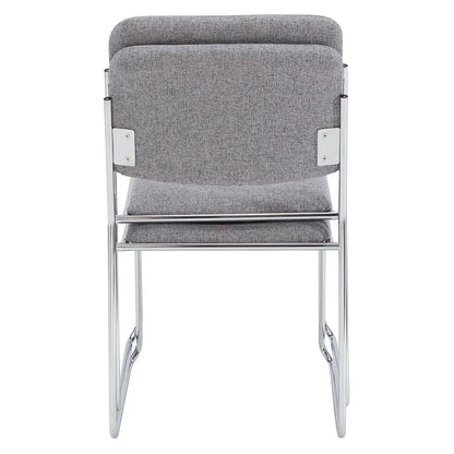 Stack of gray fabric side chairs with silver steel frames, lightweight and space-saving design for conference rooms and event seating.