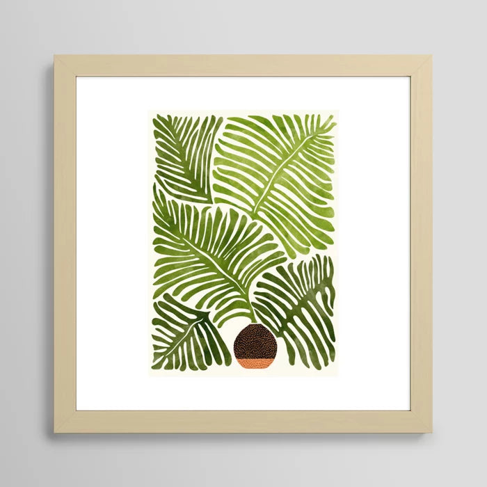 Summer Fern watercolor art print in maple frame hung in coffee shop interior