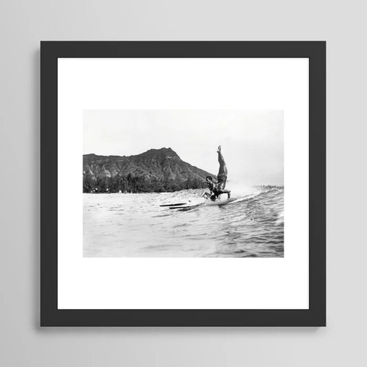 Surfing Diamond Head, Hawaii Art Print by Vintage Surf Photos framed in black wood – vintage surf photography wall art featuring Waikiki beach and Diamond Head in Hawaii