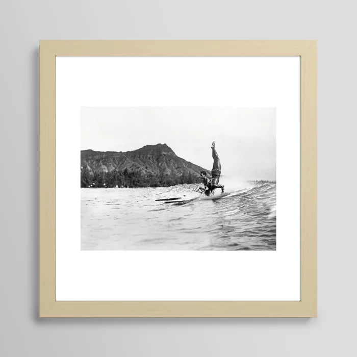 Surfing Diamond Head, Hawaii Art Print by Vintage Surf Photos framed in light maple wood – coastal wall décor featuring Waikiki surfers and iconic Diamond Head backdrop