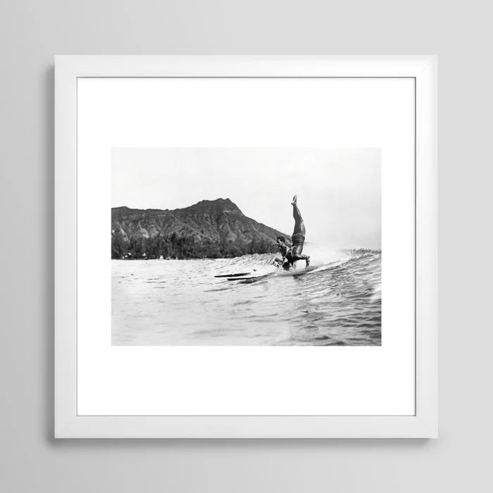 Surfing Diamond Head, Hawaii Art Print by Vintage Surf Photos framed in white wood – elegant surf art print showcasing surfers at Waikiki with Diamond Head in the distance