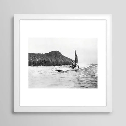Surfing Diamond Head, Hawaii Art Print by Vintage Surf Photos framed in white wood – elegant surf art print showcasing surfers at Waikiki with Diamond Head in the distance